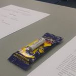 Small chocolate bar with an AAA battery taped to it